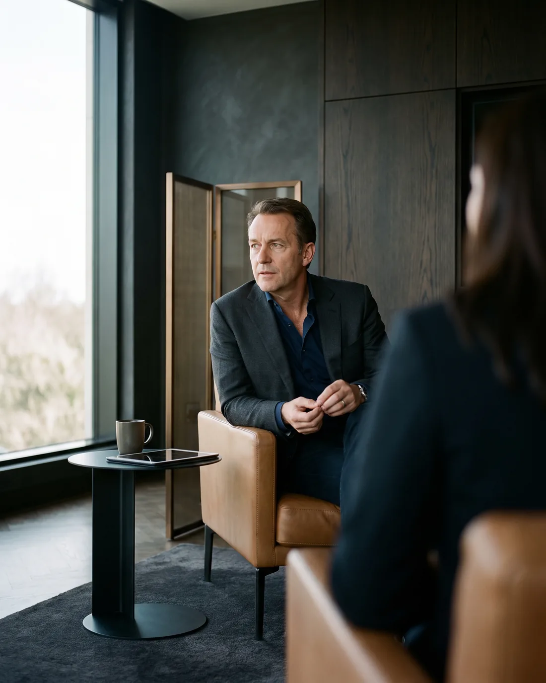 A senior CHRO reviewing the work in a calm Minneapolis boardroom
